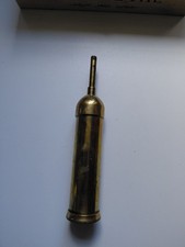Vintage brass grease gun with hexagon symbol and WAD Reg 9 on base