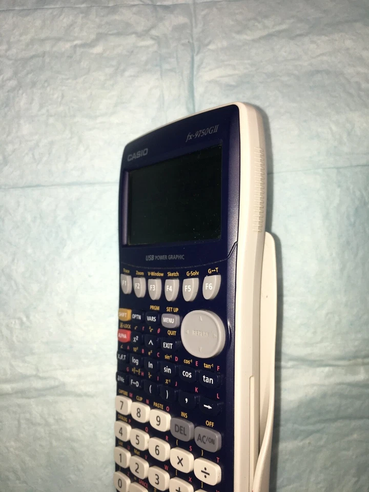 CASIO CALCULATOR FX-9750GII (with cover, batteries included, rechargeable). - Image 4 of 4