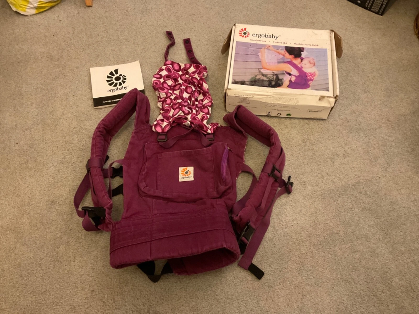 Used Ergobaby carrier in purple with box and instructions.