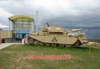 PHOTO  GUARDING THE ENTRANCE NOT SURE IF IT IS THE SAME TANK AS IN BUT THE CAMOU