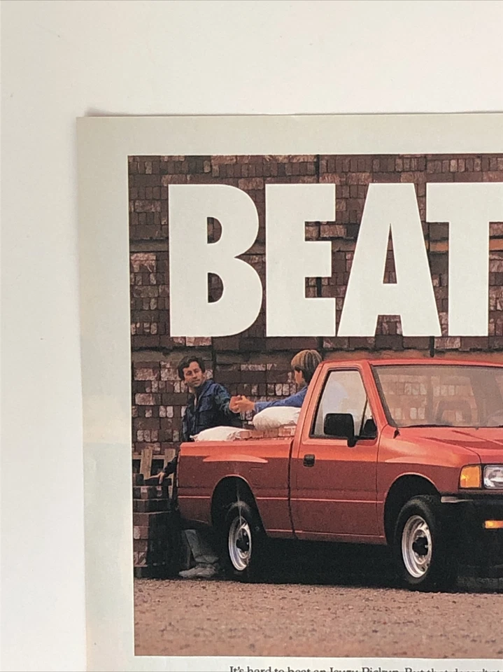 Camioneta pickup Isuzu 1991 anuncio impreso $7999 valor fiabilidad - vencer de colección años 90 roja Foto 2 de 4