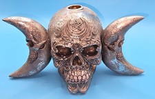 The Dark Goddess' features a silver triple moon skull incense burner