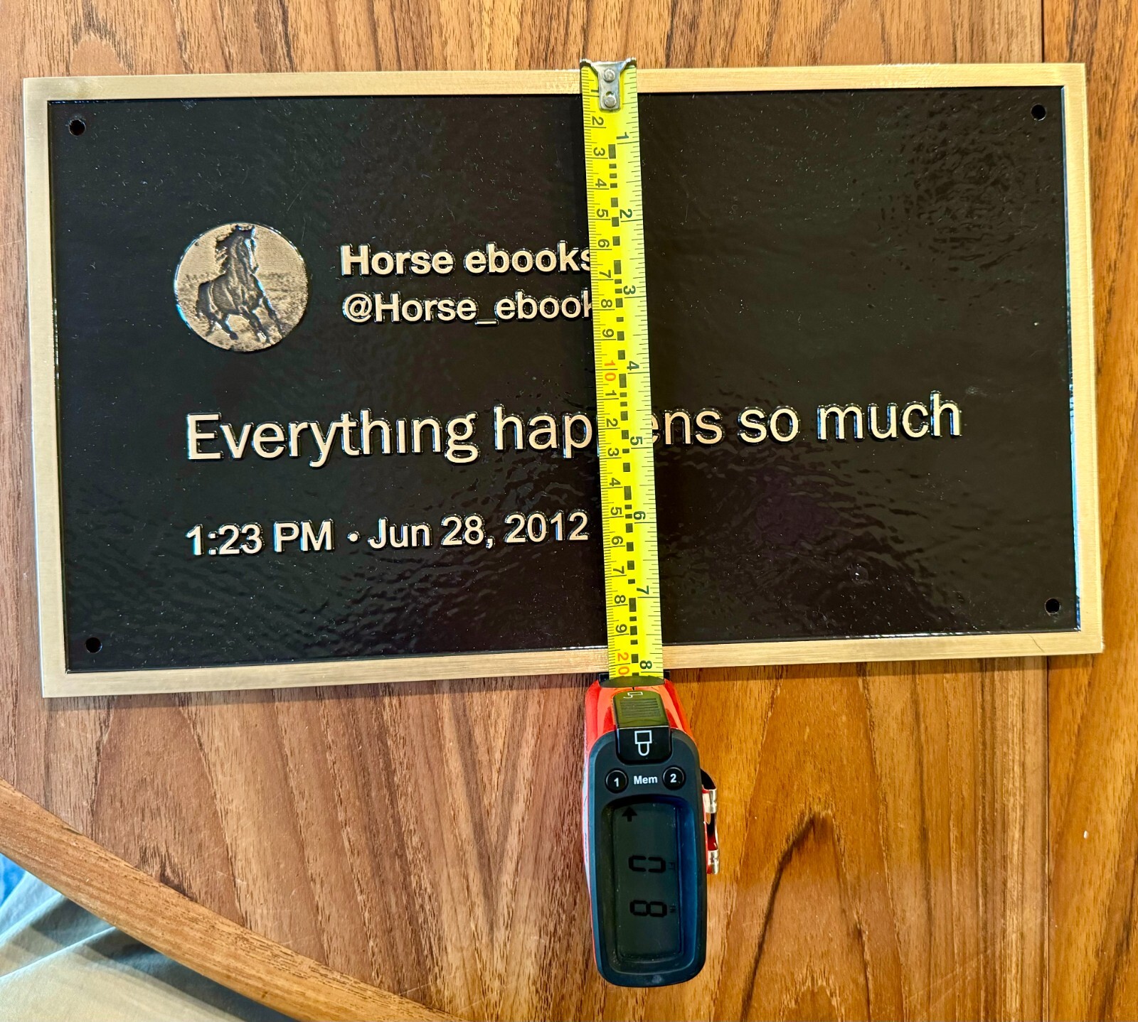 Museum quality brass plaque of Horse_ebooks tweet, "Everything happens