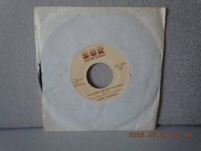 THOMPSON,HANK 7''vinyl...HERE'S TO COUNTRY MUSIC/THE HAND I'M...SOR...VG+...'88
