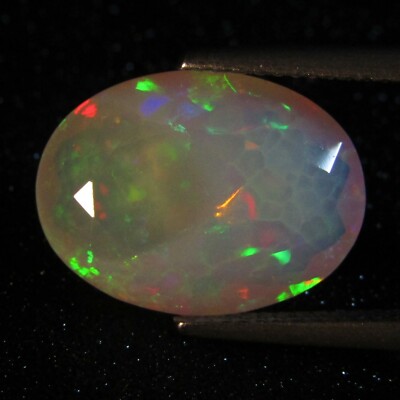 6.15Cts Natural Color Play Unheated Ethiopia White Opal Oval Cut REF VIDEO