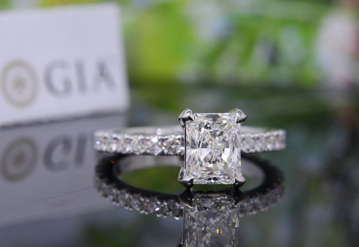 Solitaire pave shop diamond ring