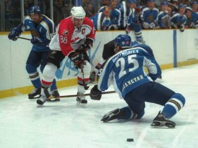 Eric Lindros of Canada chases after the puck as Erlan Sagymbayev o- Old Photo