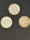 Lot of 3 Franklin Half Dollars dated 1951, 1954, and 1962.