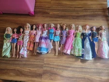 barbie doll lot and clothes lot, barbie carrying case, and Barbie Jeep