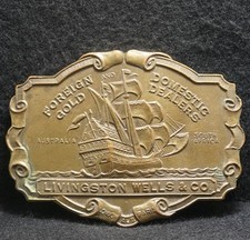 WI07122 COOL VINTAGE 1970s  LIVINGSTON WELLS  CO  FOREIGN GOLD BELT BUCKLE