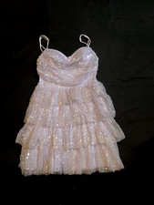 The homecoming dress is a stunning choice for formal occasions like weddings, pa