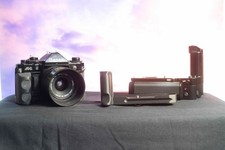 Canon A1, 28mm lens, Motor drive, two plastic arca grip all in great condition.