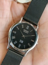 VINTAGE SEIKO SLIM QUARTZ BLACK DIAL JAPAN MEN'S WORKING DRESS WATCH