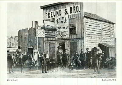 *Wyoming Postcard-''The Gun Shop'' (Between 1st & 2nd St.)- *Laramie, Wy- {C396}-