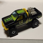 Vintage Hot Wheels Black Nissan Hardbody 1/64 Diecast Race Truck — photo 1