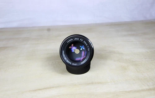 Vintage Canon Film SLR Lens FD 50mm 1:1.4 Lens W/2 LENS CAPS ( Nice.)