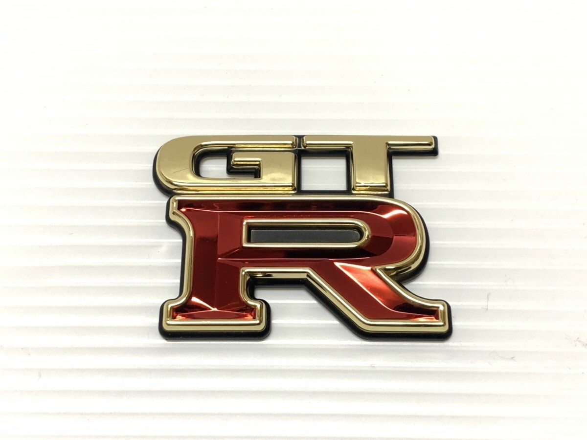 パーツ 34gtr Mea Genuine Nissan Skyline R34 GT-R Rear Emblem JDM | 84896