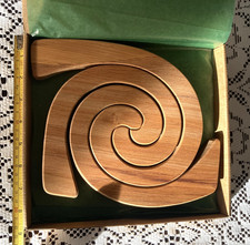 Handcrafted Interlocking Wooden Spiral Table Mats – Made by Cees Romeyn