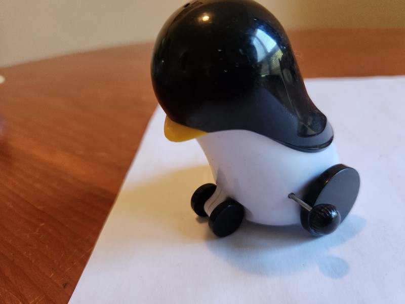 Vintage Wind Up Penguin Figure Toy on wheels - works