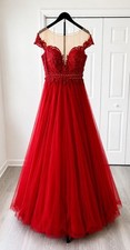 Red Gown from Terani Couture Size about a 2 Check Size Chart Below .