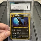 Umbreon Pokemon Japanese Neo Discovery Crossing Holo 197 CGC 8 NM/M SWIRL