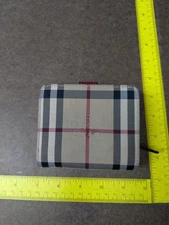 BURBERRY Nova Check trifold wallet In beige, black, red, and white plaid pattern