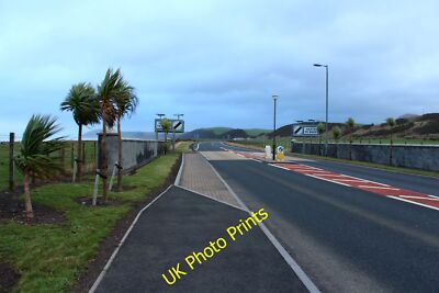Photo 12x8 Leaving Ballantrae Park End/NX0883 On a rather windy day. c2015
