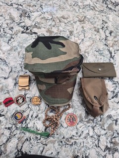War memorabilia from Iraq War in 2003 and WWII items. Military pins included.