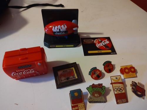 Coca-Cola Hat Pins, A Magnet And A Matchbox Blimp Decoration
