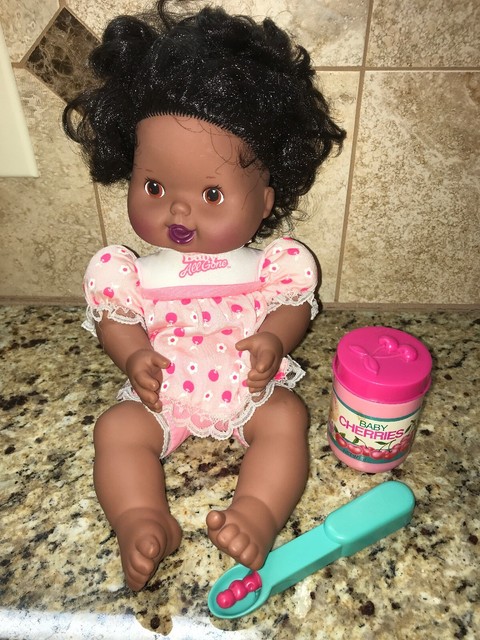 baby doll with cherry spoon