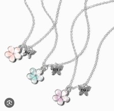 Claire  s pink purple blue flower butterfly glow-in-the-dark BFF necklace set