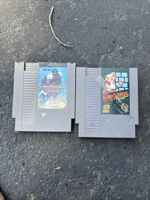 2 nintendo games mario bros and touch down fever pre-owned