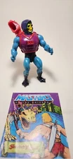 Dragon Blaster Skeletor 1984 Vintage MOTU action figure with weapons and comic.