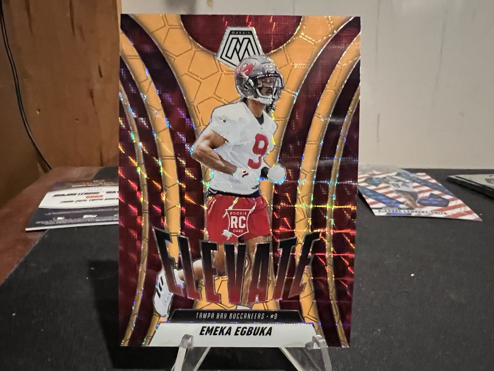 2025 Mosaic Football Emeka Egbuka RC Orange Fluorescent Prizm Elevate Insert #2