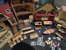 piano keyboard box with Sylvanian family bundle inside