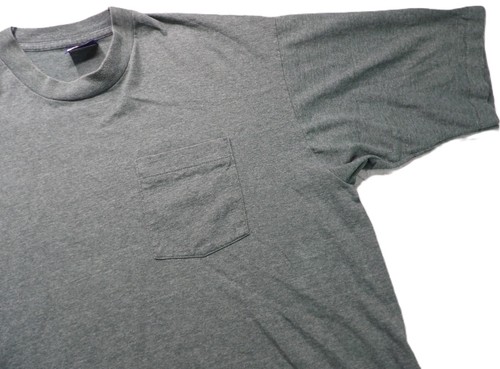 Gray VTG men’s short-sleeve shirt with single chest pocket, small purple logo on left chest, and USA made tall 80s tag.