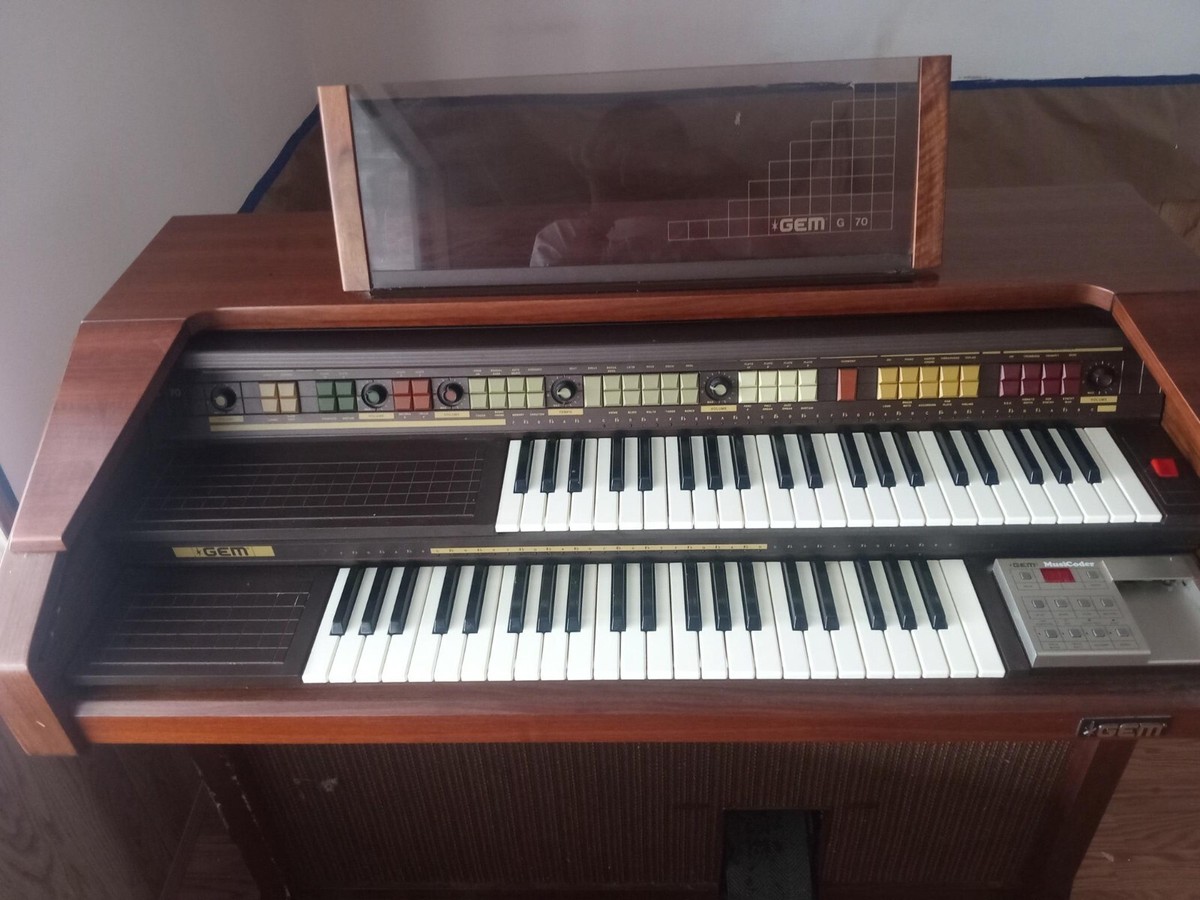 GEM G70 Electric Organ wooden exterior with a opening leather