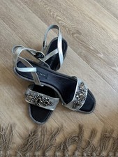 Silver sandals with medium heel, super comfy either to day wear or evening dress