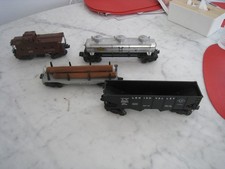 Lot of 4 Lionel Early Postwar O Gauge Train Cars Caboose Tank Freight Log Car