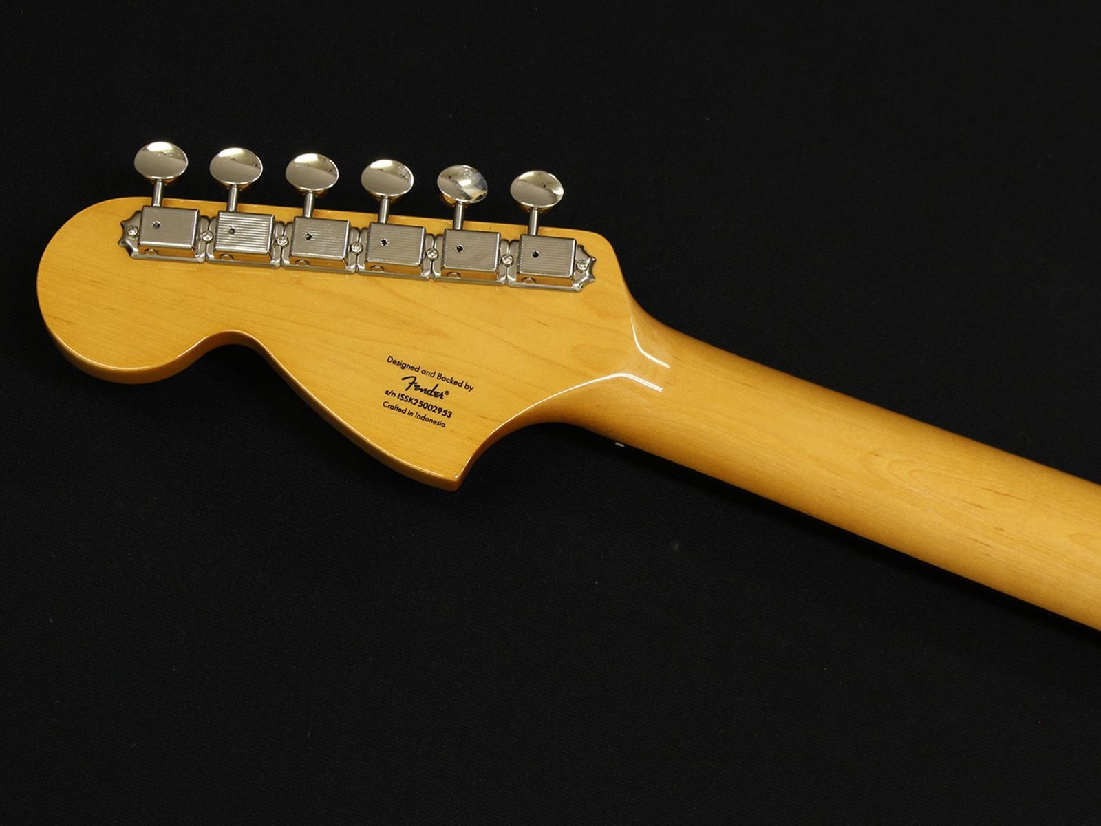 Yellow maple Squier Classic Vibe 70s Stratocaster with silver hardware and engraved brand logo on black back.