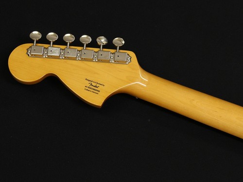 Yellow maple Squier Classic Vibe 70s Stratocaster with silver hardware and engraved brand logo on black back.
