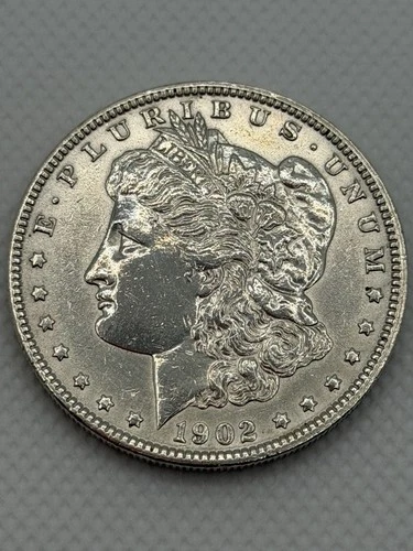 1902-P Better Date MORGAN SILVER DOLLAR. Our Opinion is AU Cleaned.