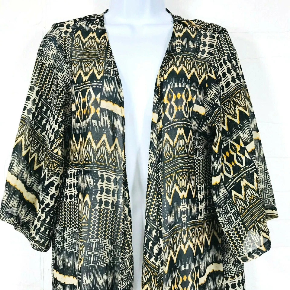 Kimono para mujer Wet Seal talla única negro tostado y dorado frente abierto con cubierta de flecos. Foto 2 de 4