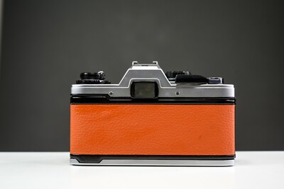 OLYMPUS OM10 35mm Film Camera w/ 50mm f/1.8 Zuiko Lens Orange