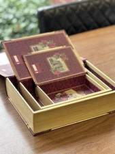 A set of decorative nesting faux storage books by Punch Studio