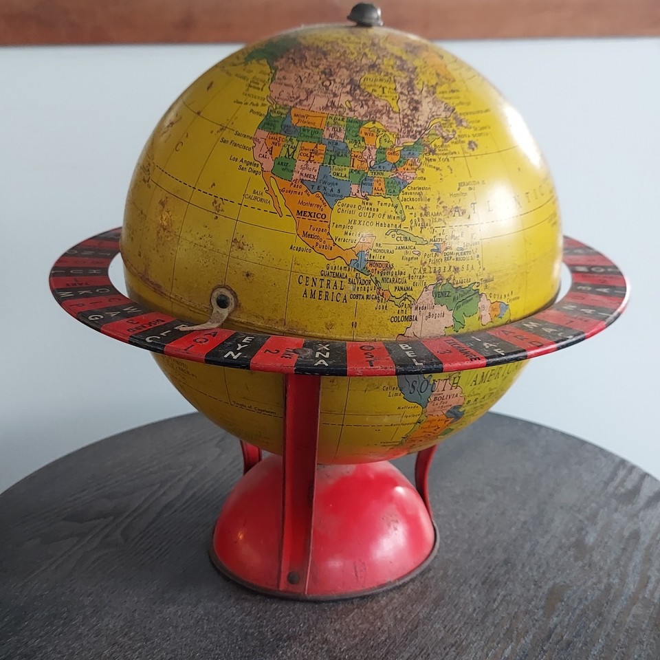 A 1954 tin lithograph Globe-Gram — a miniature time capsule of Cold War-era cartography that doubles as a stunning collectible.