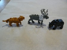 Minifiguras de animales: reno Sven, oso negro y tigre diente de sable (clones de Lego)