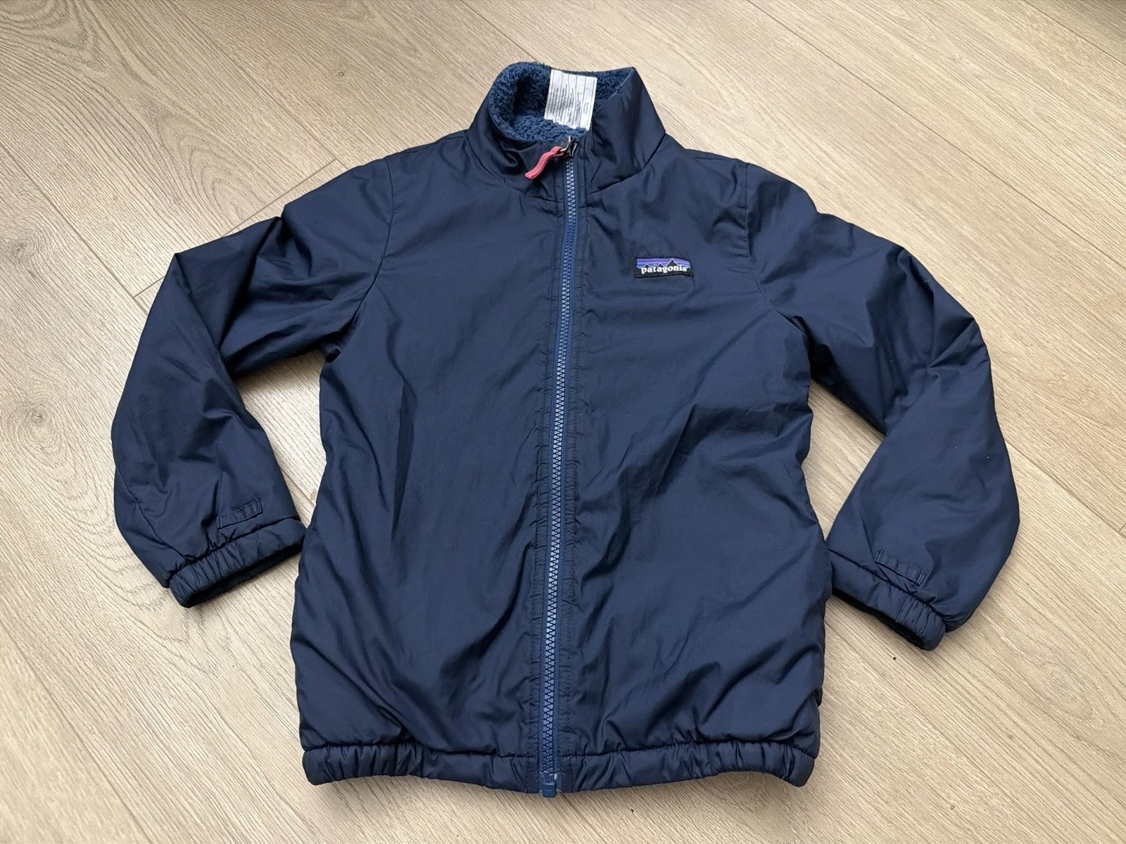 Patagonia Kids Reversible Fleece Insulated Puffer Jacket Size XS 5-6 Navy Blue
Opens in a new window
