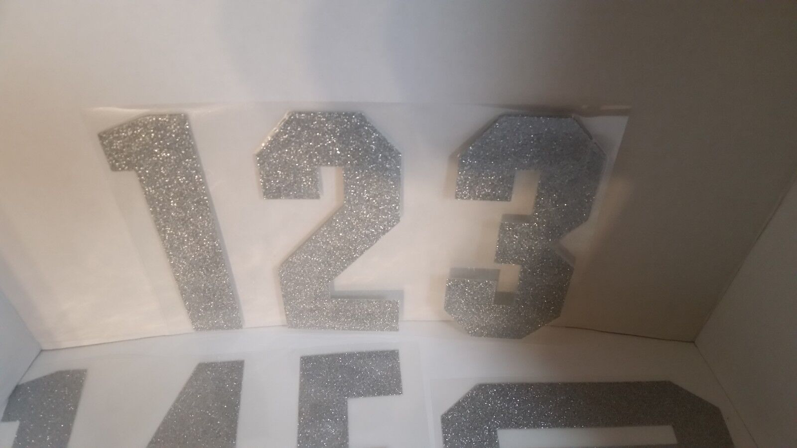 12 Packs: 12 ct. (144 total) 8 Iron-On Silver Glitter Numbers by Make  Market®