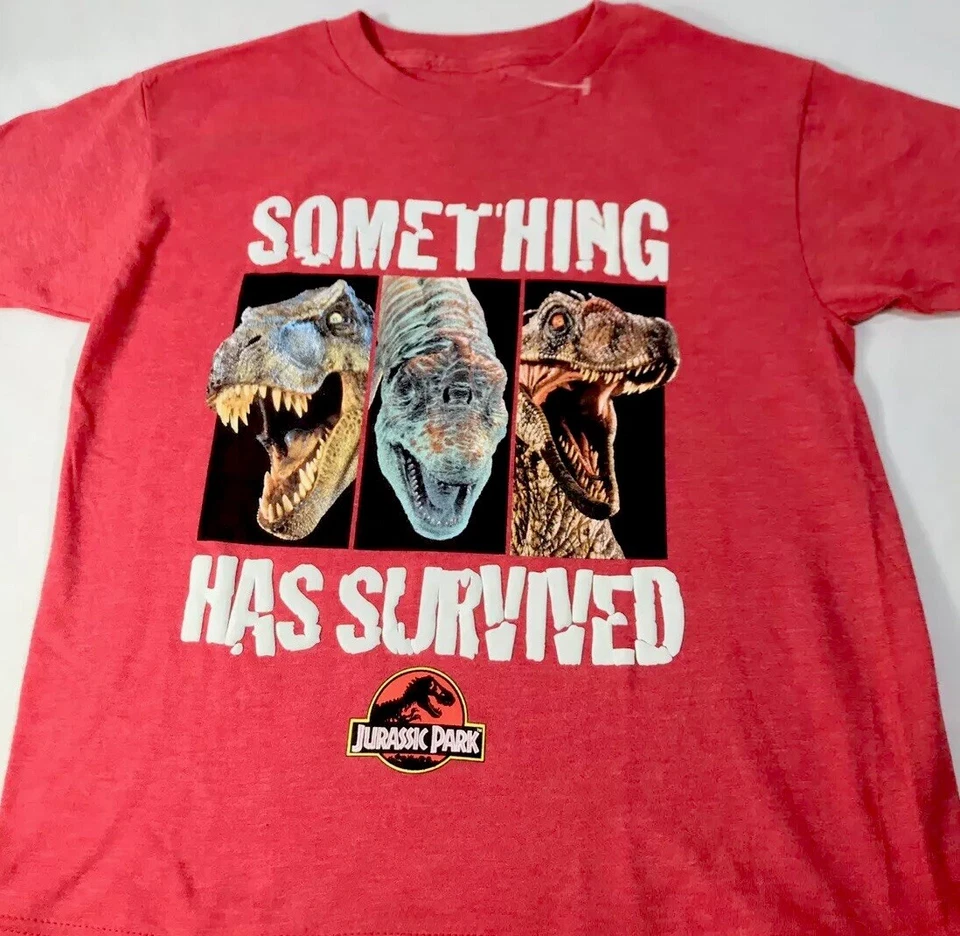 Camiseta roja Jurassic World Boys CL 14-16 Something Has Survives T-Rex Raptor S/S Foto 2 de 4